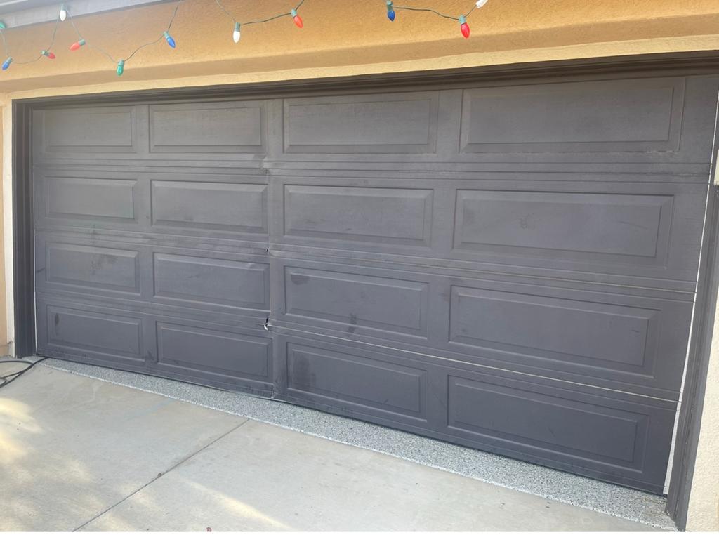 Garage Door Replacement- Someone crashed into the door. Replacing a Crashed Garage Door with a Brand New One - Before