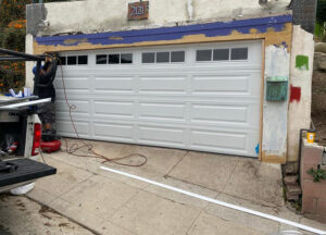Replace one piece 16 x 7 garage door with sectional windows - Job in Woodland Hills - After