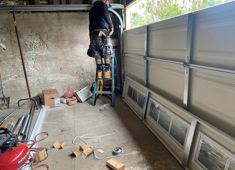 Replace one piece 16 x 7 garage door with sectional windows - Job in Woodland Hills